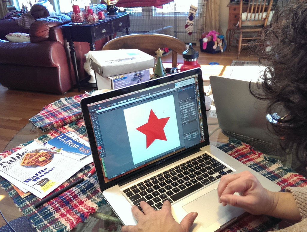 Peggy sketching a star in InDesign.